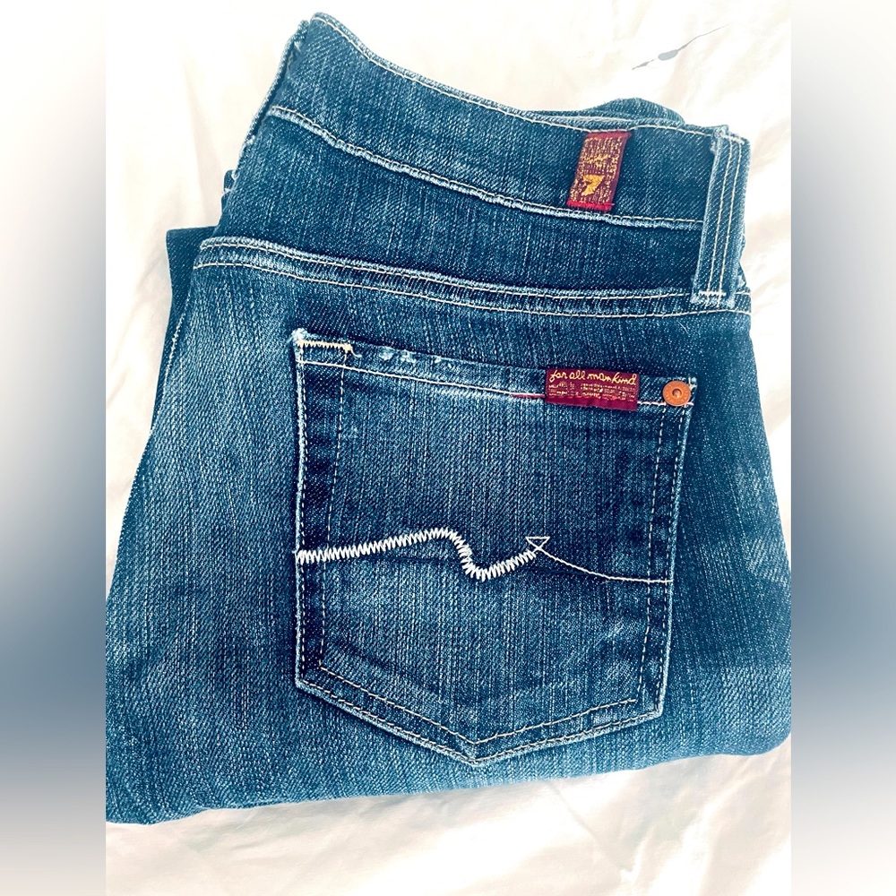 Dark wash straight leg jeans.